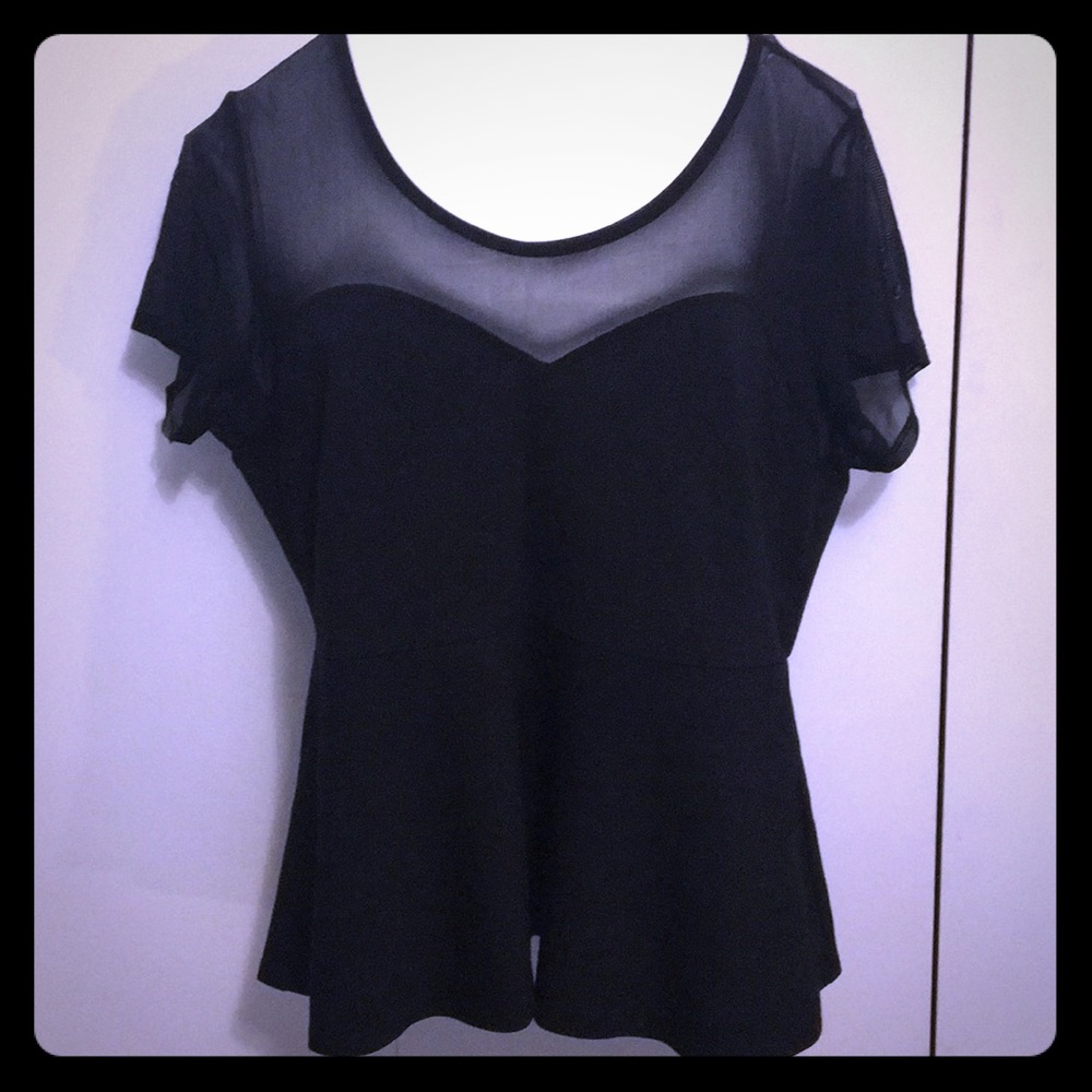 Flirty black and sheer peplum top